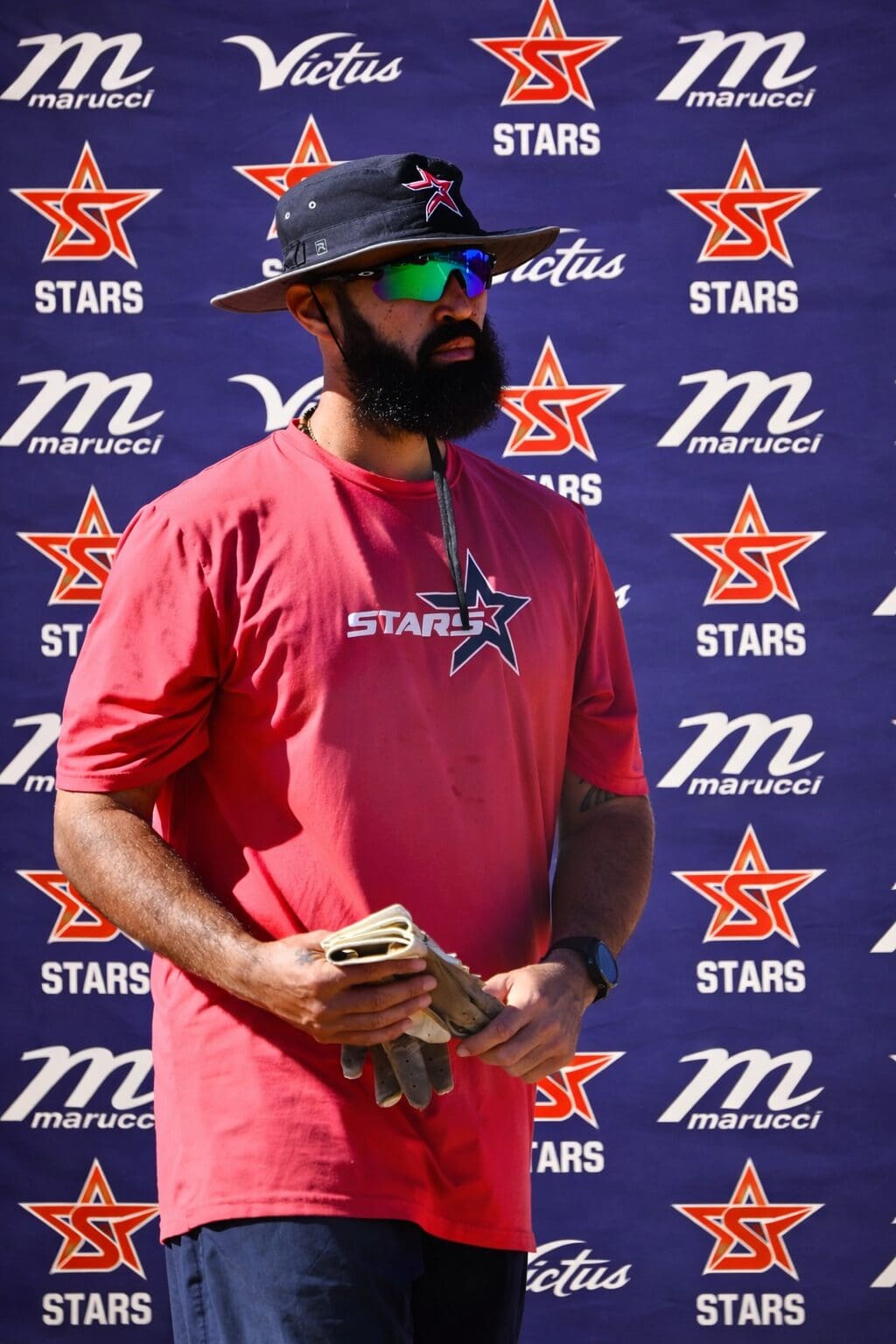 Focused star athlete with baseball glove